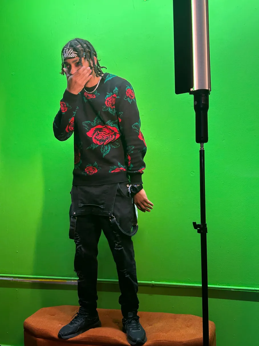 Prezident Cutt on set in front of a green screen